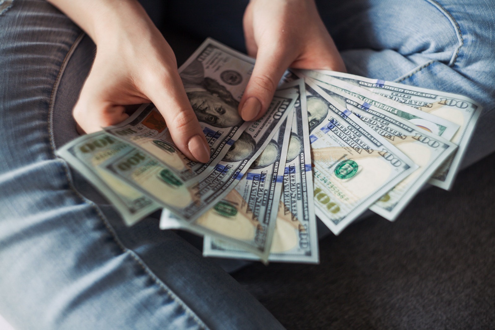 Person holding cash in hand